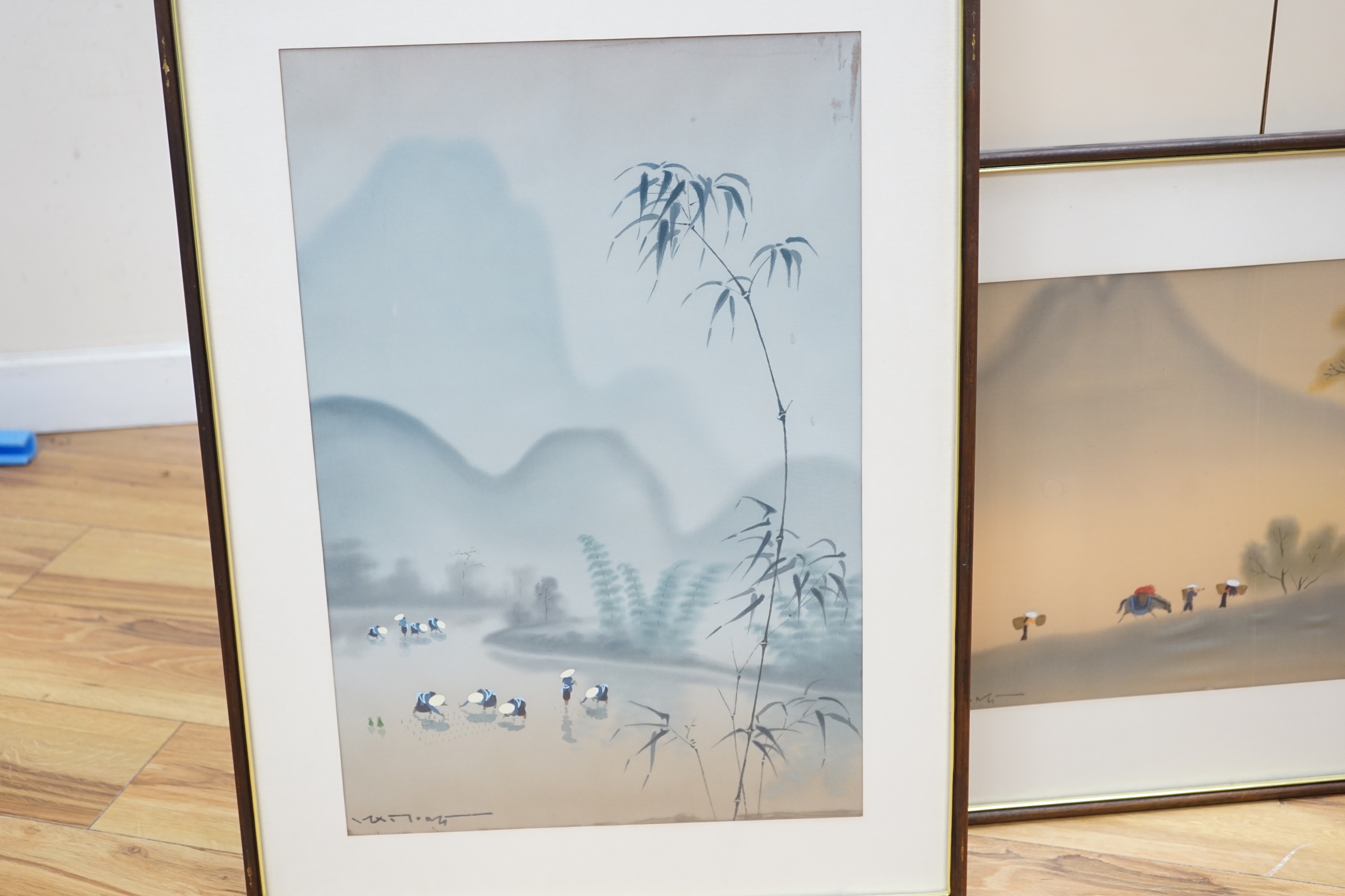 Four 20th century Vietnamese watercolour paintings on silk depicting street scene, lake scene and rice planting, all signed, largest 56 x 36cm, glazed frames